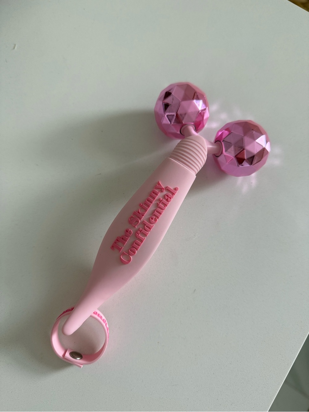 The Skinny Confidential pink balls facial massager